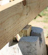 Tips and Ideas on How To Build a Floating Deck: Beam Laid Across Deck Block